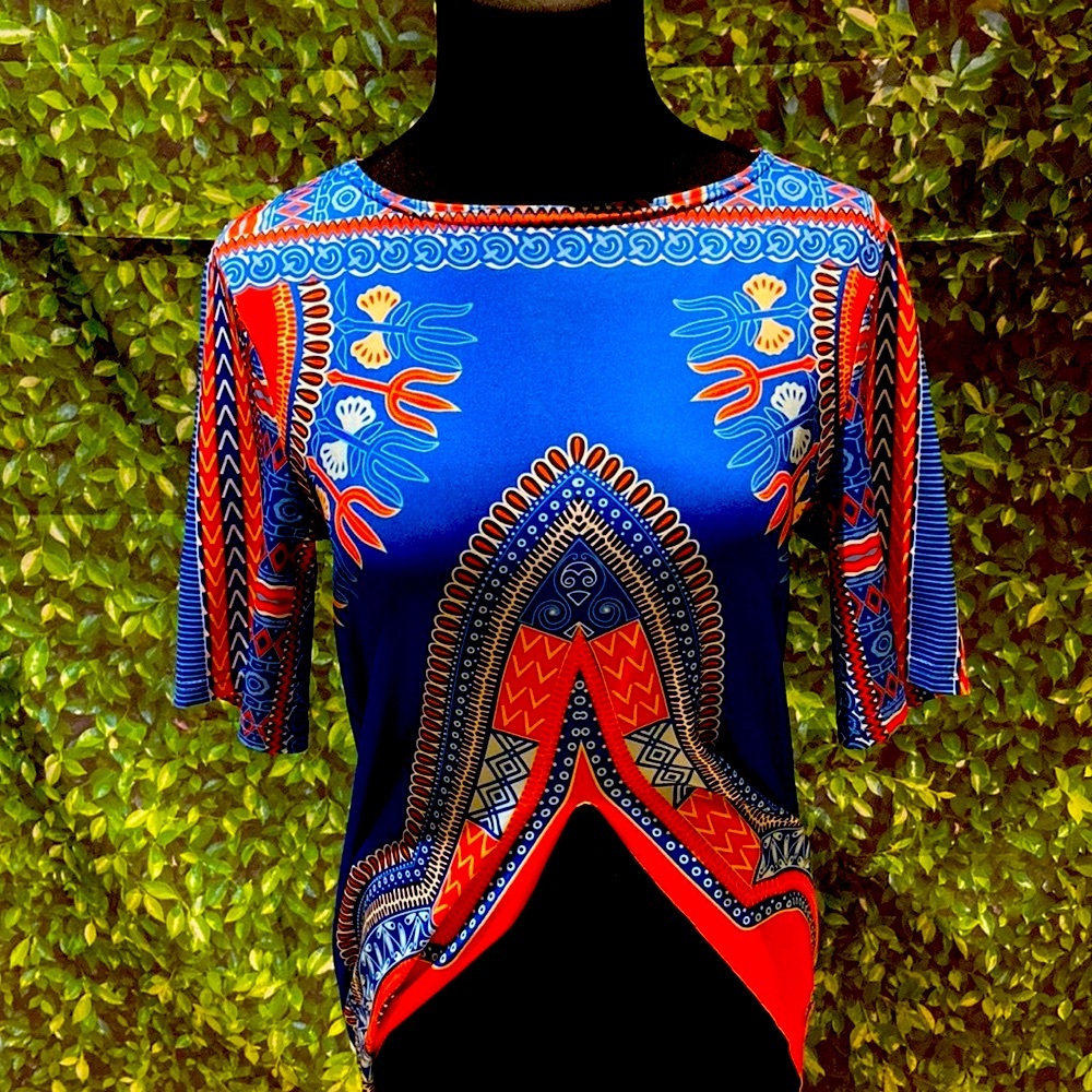 A silk African print shirt with long flaps on the sides and medium length sleeve